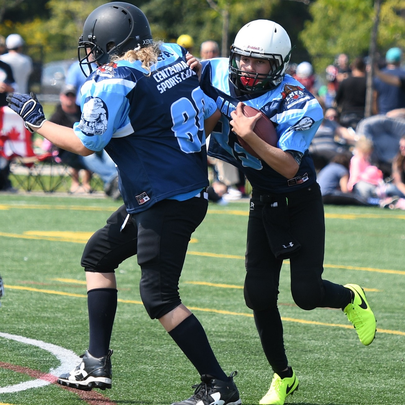 QB runs behind blocker