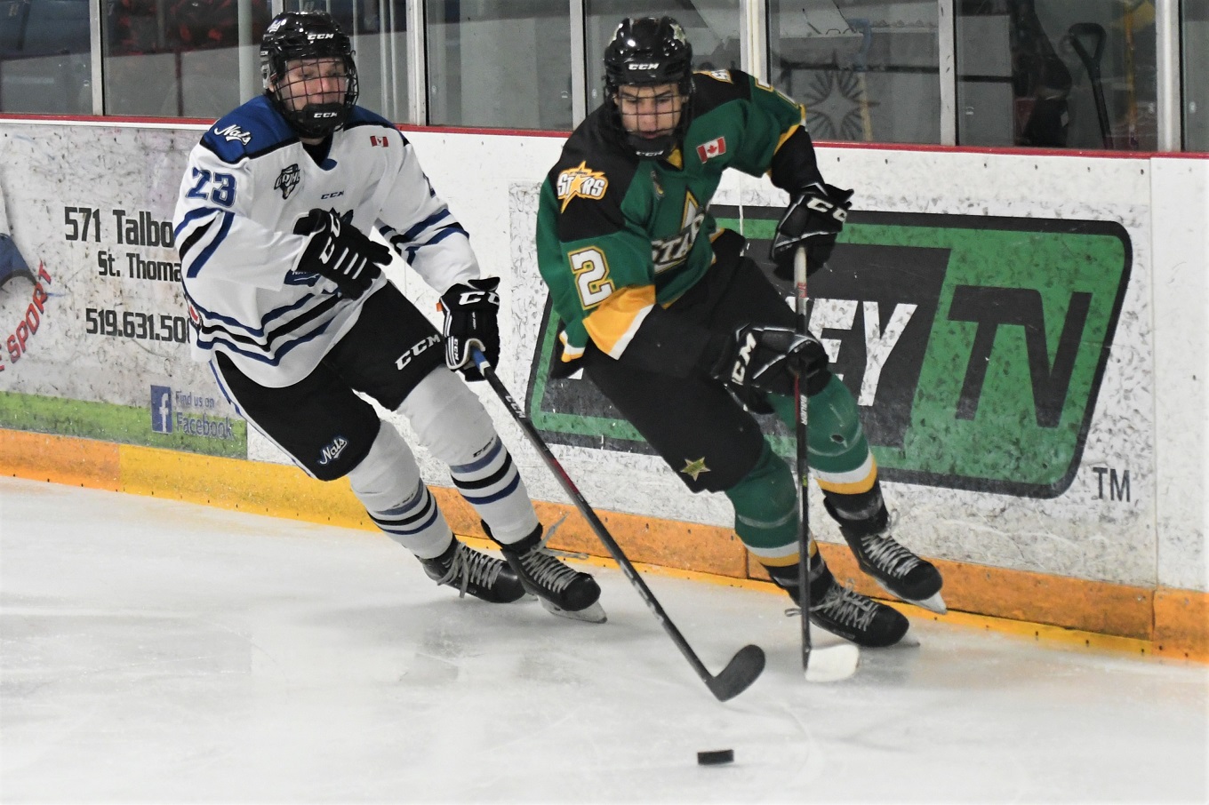 St. Thomas Star Trent Ballentyne (2)and London National Sam Vander Zalm race for the puck, during GOJHL action Friday at the Joe. <i> (photo / Rob J. Ross) </i> action