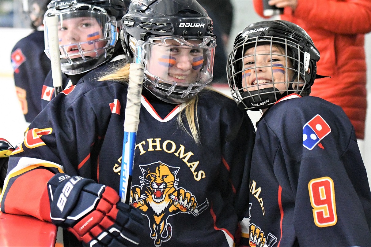 St. Thomas Panthers' Emma Cipu and Jane Hewitt (9) share smiles during a stoppage in play against the Lambton Attack during U13B action, at the Panthers on the Prowl hockey tournament, Saturday at the Joe.   <i> (photo / Rob J. Ross) </i> action