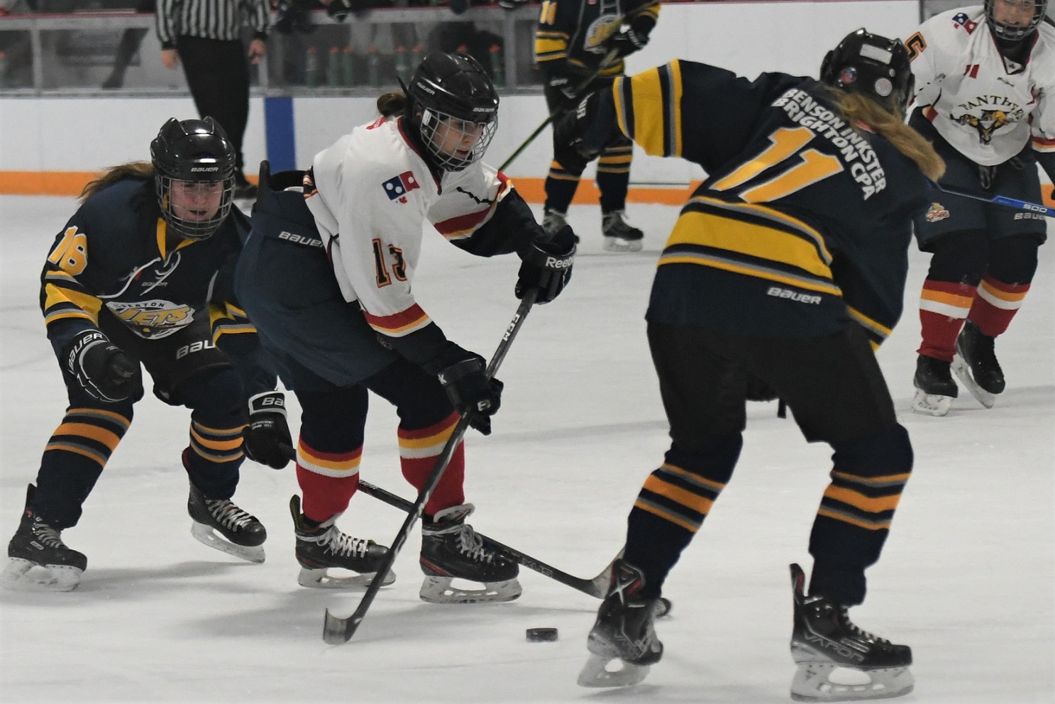 St. Thomas Panther Riley Cipu attempts to cut between Ilderton Jets' Emily Hansen (16) and Lauren Kelly (11), during the U18 B final, at the Panthers on the Prowl hockey tournament, Sunday at the Joe. St. Thomas won 1-0.  <i> (photo / Rob J. Ross) </i> action