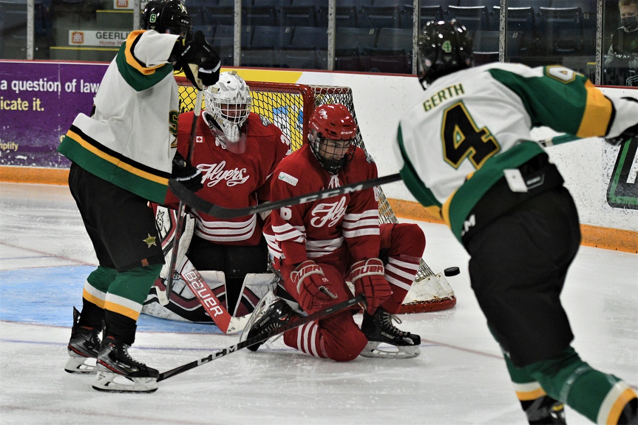 St. Thomas Star Tristen Gerth see the puck he shot blocked by Leamington Flyer Ryan Clark during Greater Ontario Junior Hockey at the Joe.   <i> (photo / Rob J. Ross) </i> action